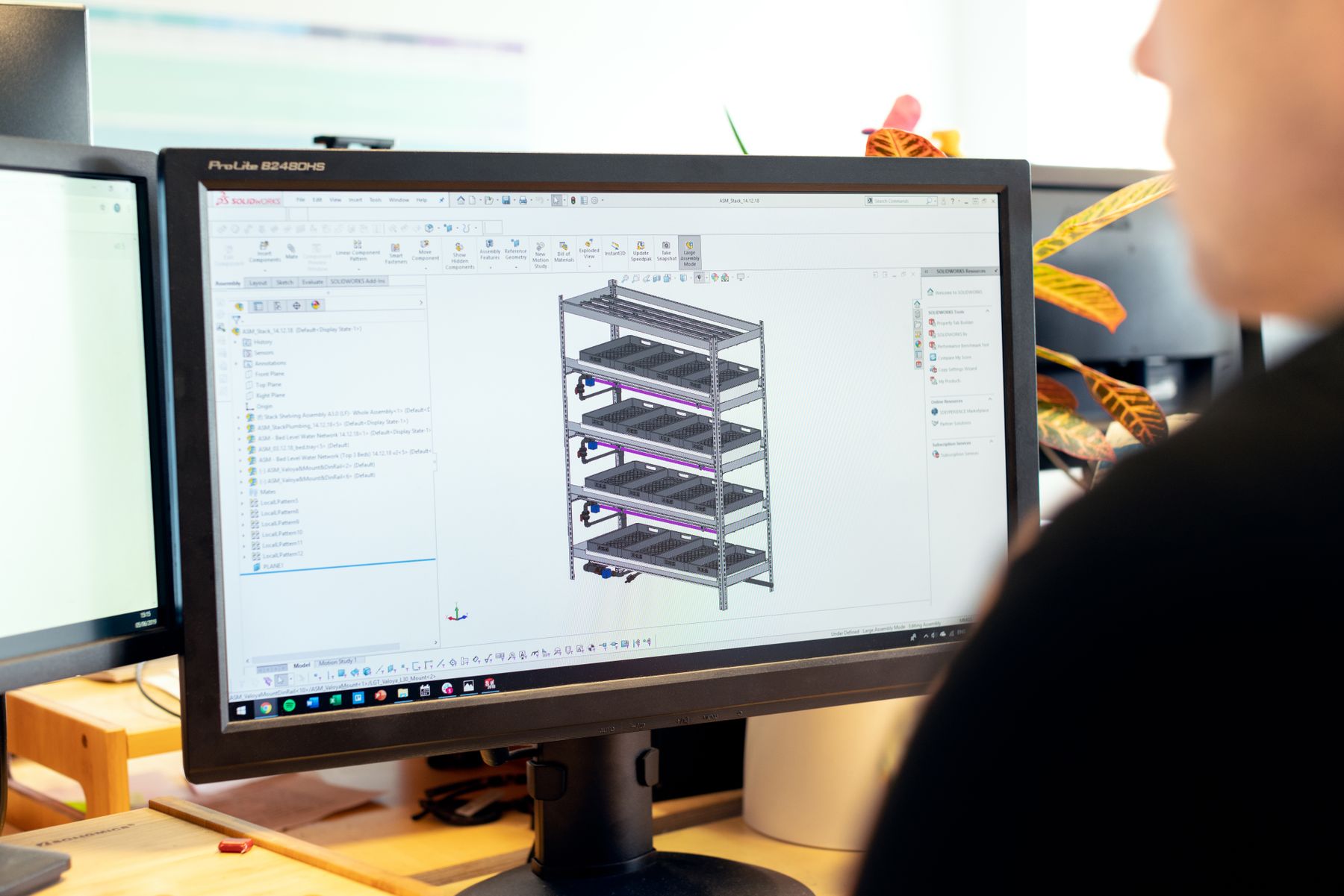 Three-dimensional structural assembly model open on a CAD workstation display