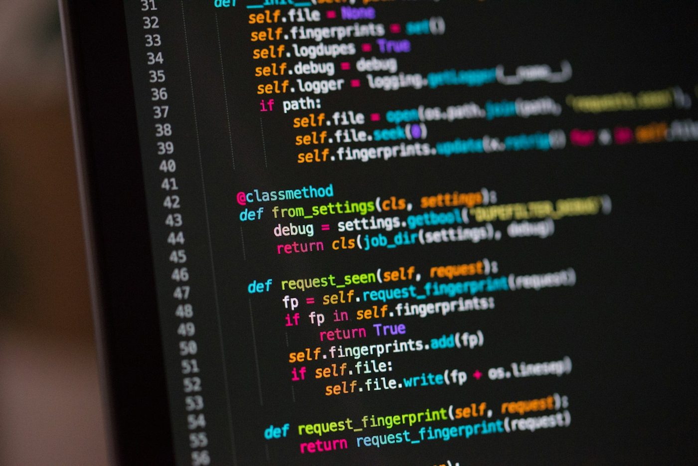 Program source code on a dark editor screen