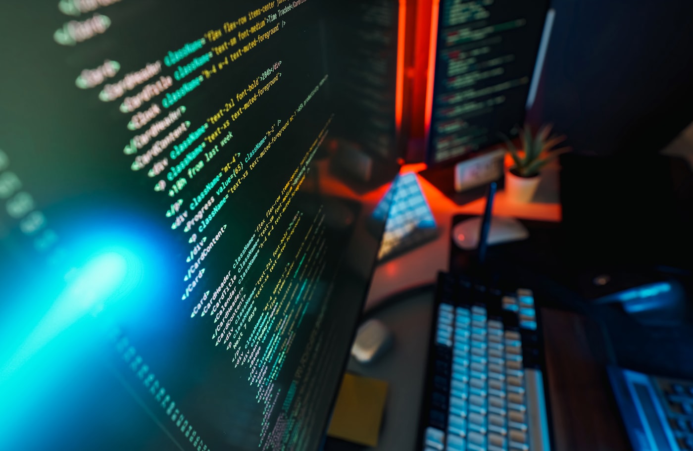 Source code with syntax highlighting displayed on a monitor at a developer workstation